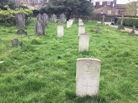 Photo by Sheila Webber of past and future - graves and a pram - Pleasaunce in April 2024